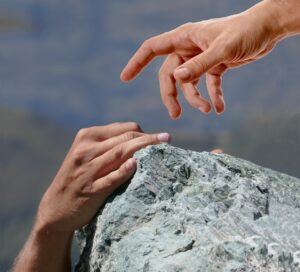 Rock climber provides helping hand